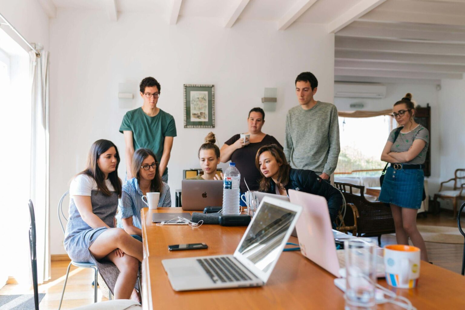 Solutions Page featured image, people brainstorming a solution